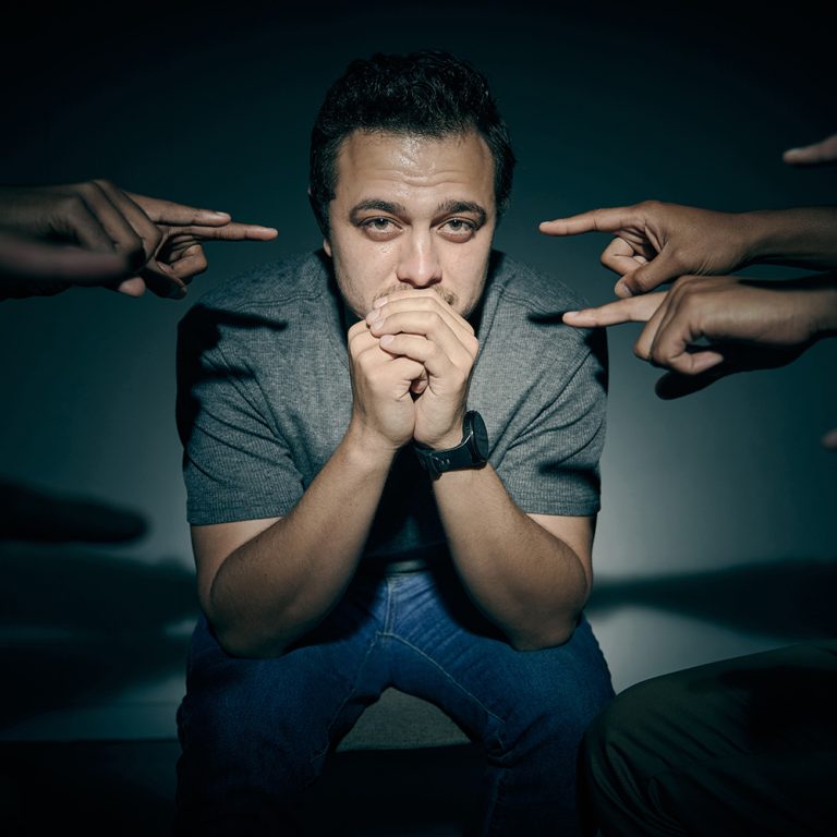 One mixed race male suffering mental illness in asylum. Caucasian schizophrenic man experiencing a .