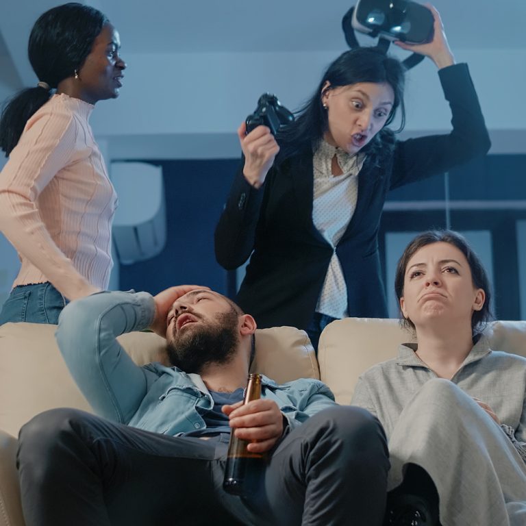 Group of diverse people sitting on sofa, talking and crying in group therapy session. Lifestyle, friendship and support, togetherness, unaltered.